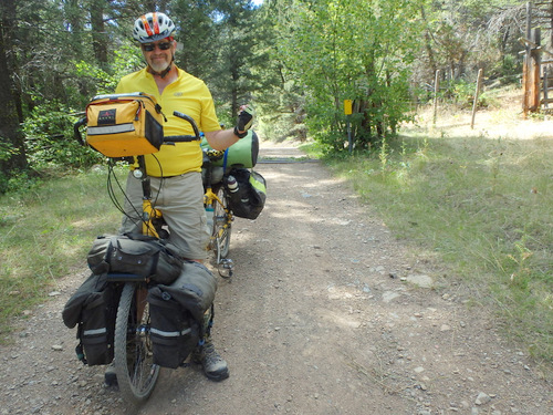 GDMBR: Behind Dennis is the Cattle Guard and Gate for Helena National Forest.